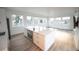 Living room with a kitchen island, stainless steel appliances, and natural light at 5462 S Cedar St, Littleton, CO 80120