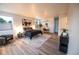 Spacious main bedroom with hardwood floors, lots of natural light, modern decor, and a cozy seating area at 5462 S Cedar St, Littleton, CO 80120