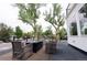 Outdoor patio area with comfortable seating and a view of the surrounding trees at 5462 S Cedar St, Littleton, CO 80120