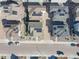An aerial view of a neighborhood showcasing the layout and proximity of houses with solar panels on the roofs at 8409 Rush Creek Ave, Littleton, CO 80125