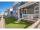 Inviting back porch and fenced yard, perfect for outdoor gatherings and relaxation at 8409 Rush Creek Ave, Littleton, CO 80125