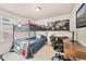 Comfortable bedroom featuring a bunk bed, desk, and stylish decor, perfect for a or guest at 8409 Rush Creek Ave, Littleton, CO 80125
