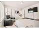 Relaxing bedroom featuring a plush armchair, modern lighting, and serene ambiance at 8409 Rush Creek Ave, Littleton, CO 80125