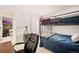 Another view of the comfortable bedroom featuring a bunk bed, desk, and stylish decor at 8409 Rush Creek Ave, Littleton, CO 80125