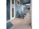 Charming front porch with seating, creating a welcoming entrance to the home at 8409 Rush Creek Ave, Littleton, CO 80125