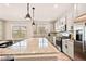 Bright kitchen featuring granite countertops, stainless steel appliances, and ample cabinet space at 8409 Rush Creek Ave, Littleton, CO 80125