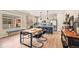 Well-lit kitchen with grey cabinets, an eat-in island, and stainless steel appliances at 8409 Rush Creek Ave, Littleton, CO 80125