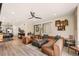 Cozy living room featuring leather furniture, an open layout, and lots of natural light at 8409 Rush Creek Ave, Littleton, CO 80125