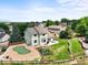 Aerial view showcasing the backyard's putting green, lush lawn, and well-maintained surroundings at 9916 Sand Cherry Way, Highlands Ranch, CO 80129