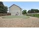 Backyard boasts a putting green and gravel area for outdoor enjoyment and landscaping at 9916 Sand Cherry Way, Highlands Ranch, CO 80129