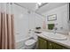Well-maintained bathroom with shower/tub combo and a green vanity at 9916 Sand Cherry Way, Highlands Ranch, CO 80129