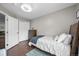 Cozy bedroom with a large bed, neutral tones, and ample closet space at 9916 Sand Cherry Way, Highlands Ranch, CO 80129