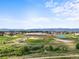 Scenic community view with sports fields, grassy fields, and mountain views in the distance at 9916 Sand Cherry Way, Highlands Ranch, CO 80129
