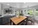 Bright open kitchen featuring stainless steel appliances, island, and a breakfast nook at 9916 Sand Cherry Way, Highlands Ranch, CO 80129