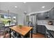 Bright open kitchen featuring stainless steel appliances, island, and breakfast nook with backyard views at 9916 Sand Cherry Way, Highlands Ranch, CO 80129