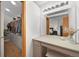Walk-in closet with custom shelving and a vanity area at 9916 Sand Cherry Way, Highlands Ranch, CO 80129