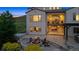 Exterior back of home with patio, fire pit, hot tub, and mountain views at 15490 W Asbury Ave, Lakewood, CO 80228