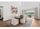 Bright, open dining room with modern decor and an amazing outdoor mountain view at 15490 W Asbury Ave, Lakewood, CO 80228