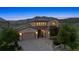Stunning home with a three-car garage and picturesque mountain views in the background at 15490 W Asbury Ave, Lakewood, CO 80228