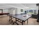 Spacious game room with a ping pong table, large windows, hardwood floors, and recessed lighting at 15490 W Asbury Ave, Lakewood, CO 80228