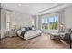 Main bedroom with natural light, hardwood floors and views at 15490 W Asbury Ave, Lakewood, CO 80228