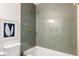 Updated bath area with sleek tiling, brass fixtures, and contemporary design at 3501 W 41St Ave, Denver, CO 80211