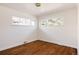 Empty room boasting hardwood floors and abundant natural light from multiple windows at 3501 W 41St Ave, Denver, CO 80211