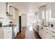 Modern kitchen with white cabinets, stainless steel appliances, and hardwood floors at 3501 W 41St Ave, Denver, CO 80211