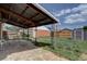 Backyard features covered patio, metal shed, and grassy yard at 10900 Mildred Dr, Northglenn, CO 80233