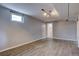 Finished basement offers a versatile space with laminate floors, ample lighting, and a convenient window at 10900 Mildred Dr, Northglenn, CO 80233