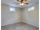 Bedroom features dual windows, ceiling fan and gray tiled floor at 10900 Mildred Dr, Northglenn, CO 80233