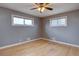 Sunlit bedroom features two windows and a ceiling fan enhancing comfort and style at 10900 Mildred Dr, Northglenn, CO 80233