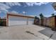Detached two-car garage featuring ample parking space and convenient access, surrounded by a wood fence at 10900 Mildred Dr, Northglenn, CO 80233