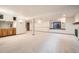 Spacious basement with a bar area, carpet flooring, and a fireplace, perfect for entertaining at 9096 E Colorado Cir, Denver, CO 80231