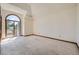 Bright bedroom with large windows, access to a balcony, and carpet flooring at 9096 E Colorado Cir, Denver, CO 80231