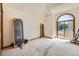 Bright bedroom with large windows, access to a balcony, and carpet flooring at 9096 E Colorado Cir, Denver, CO 80231