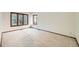 Bright bedroom featuring two large windows and neutral carpeting at 9096 E Colorado Cir, Denver, CO 80231