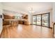 Open-concept kitchen and dining area with sliding glass doors to the backyard at 9096 E Colorado Cir, Denver, CO 80231