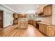 Spacious kitchen featuring wooden cabinets, granite countertops, and a center island at 9096 E Colorado Cir, Denver, CO 80231