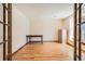 Bright office space with wood floors, desk, and plenty of natural light at 9096 E Colorado Cir, Denver, CO 80231