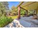 Covered back patio with brick pillars provides an inviting outdoor living space at 9096 E Colorado Cir, Denver, CO 80231