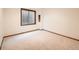 Neutral room with carpet, natural trim, baseboard and a window, ready to be customized at 9096 E Colorado Cir, Denver, CO 80231