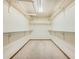 Walk-in closet with wall-to-wall shelving, carpet floor, and excellent storage capacity at 9096 E Colorado Cir, Denver, CO 80231