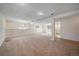 Large, unfinished basement space with carpet, recessed lighting, and natural light at 10832 W Powers Pl, Littleton, CO 80127