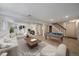 Staged basement living area featuring a pool table and comfortable seating at 10832 W Powers Pl, Littleton, CO 80127