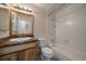 Full bathroom with tiled floor, vanity, and a shower-tub combo at 10832 W Powers Pl, Littleton, CO 80127