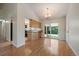 Bright dining area with hardwood floors, a sliding door to a backyard deck, and easy access to the kitchen at 10832 W Powers Pl, Littleton, CO 80127