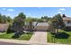 Charming single-Gathering home with a well-manicured lawn and an attached garage, nestled among mature trees at 10832 W Powers Pl, Littleton, CO 80127