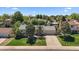 Inviting single-Gathering home featuring a landscaped front yard and a convenient driveway leading to the garage at 10832 W Powers Pl, Littleton, CO 80127