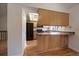 Well-lit kitchen with countertops, stainless steel appliances, and hardwood floors, perfect for cooking at 10832 W Powers Pl, Littleton, CO 80127